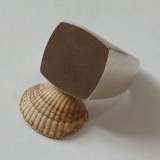 Square curved edge signet ring in silver with broad shoulders